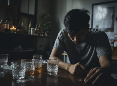 a young asian man in their early twenties who is experiencing a hangover after a night of excessive drinking, clean room, cinematic photography, cinematic tones, cinematic color grading --ar 3:2 --style raw --v 5.2 Job ID: f6a48511-e2d4-4e5c-8711-39b2e33509ae